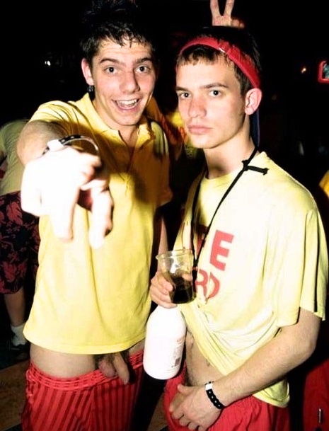 two drunk lads show cocks while they are dancing